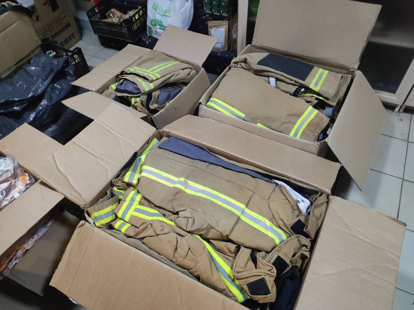 Boxes of firefighter combat gear ready for delivery to Ukrainian frontline units