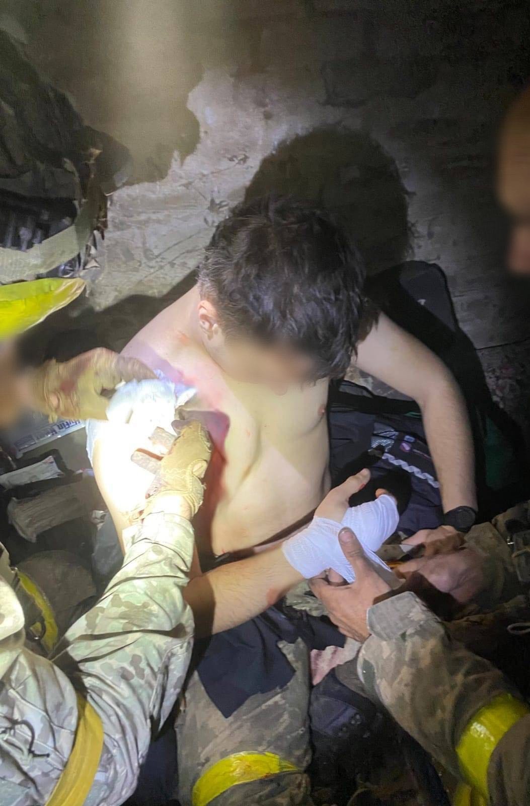 Frontline medic treating wounded soldier - the reality Medaria Aid works to change