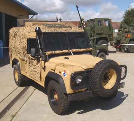 Military Land Rover Defender in desert camouflage - vehicle deployed by Medaria Aid to Ukrainian frontline units